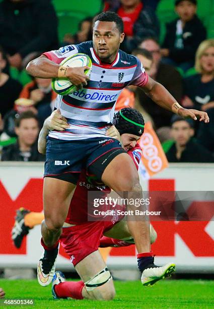 Sefanaia Naivalu of the Rebels runs with the ball during the round eight Super Rugby match between the Rebels and the Reds at AAMI Park on April 3,...