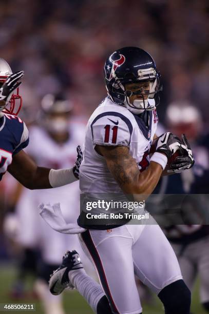 Wide receiver DeVier Posey of the Houston Texans runs the ball during the AFC Divisional Playoff against the New England Patriots at Gillette Stadium...