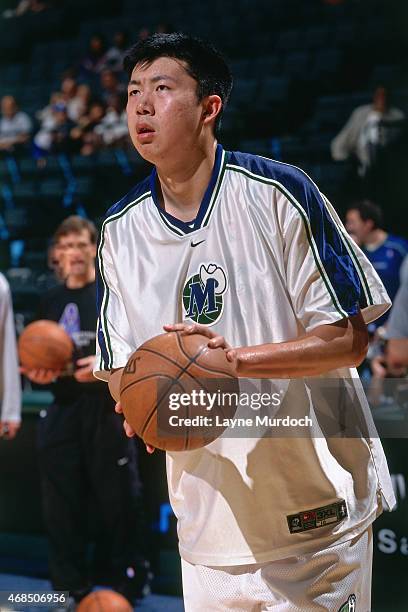 Wang ZhiZhi of the Dallas Mavericks shoots against the Atlanta Hawks on April 5, 2001 at American Airlines Arena in Dallas, Texas. Wang ZhiZhi is the...