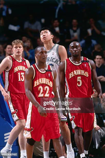 Wang ZhiZhi of the Dallas Mavericks stands against the Atlanta Hawks on April 5, 2001 at American Airlines Arena in Dallas, Texas. Wang ZhiZhi is the...
