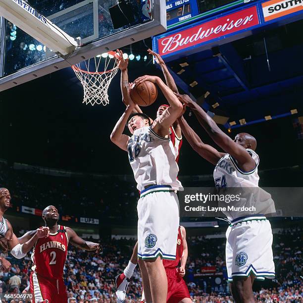 Wang ZhiZhi of the Dallas Mavericks rebounds against the Atlanta Hawks on April 5, 2001 at American Airlines Arena in Dallas, Texas. Wang ZhiZhi is...