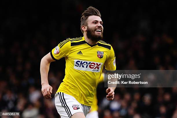 Stuart Dallas of Brentford celebates scoring his second goal during the Sky Bet Championship match between Fulham and Brentford at Craven Cottage on...