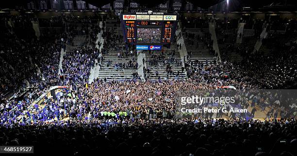 Kansas State Wildcats fans storm the floor after beating the Kansas Jayhawks on February 10, 2014 at Bramlage Coliseum in Manhattan, Kansas. Kansas...