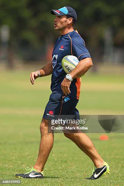 Waratahs defence coach Nathan Grey shouts instructions during a Waratahs Super Rugby training session at Moore Park on February 11, 2014 in Sydney,...