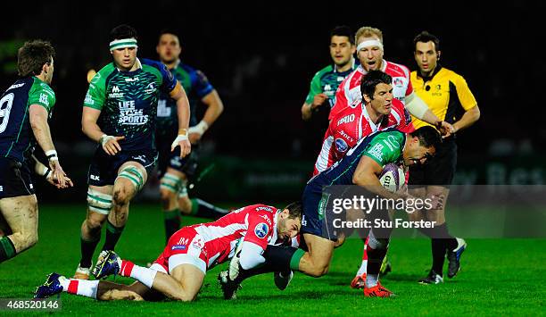 Connacht full back Mils Muliaina is stopped by Jonny May and James Hook of Gloucester during the European Rugby Challenge Cup Quarter Final match...