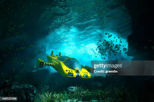 unterwasserhöhle mit u-boot, das meer und erkundungen - tiefsee stock-fotos und bilder