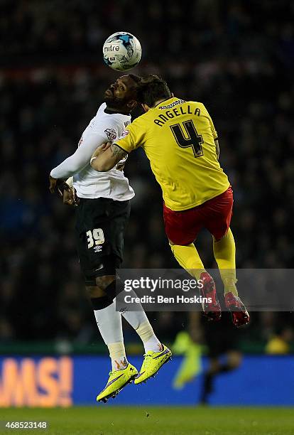 Darren Bent of Derby and Gabriele Angella of Watford battle for an aerial ball during the Sky Bet Championship match between Derby County and Watford...