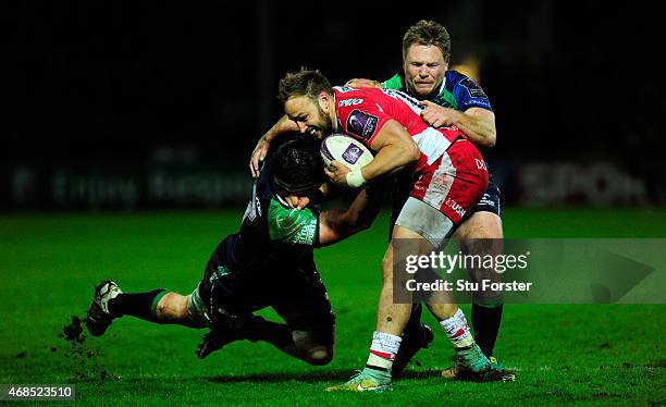 Gloucester centre Bill Meakes is tackled by Eoghan Masterson and Tom McCartney during the European Rugby Challenge Cup Quarter Final match between...