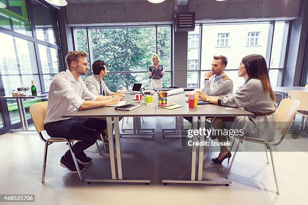 team of architects having meeting in office - agency creative stockfoto's en -beelden