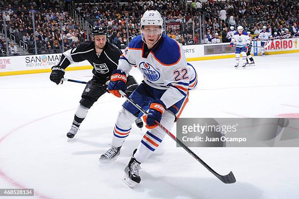 Kyle Clifford of the Los Angeles Kings skates against Keith Aulie of the Edmonton Oilers at STAPLES Center on April 02, 2015 in Los Angeles,...