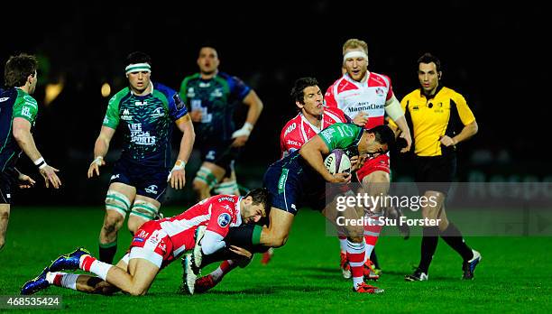 Connacht full back Mils Muliaina is stopped by Jonny May and James Hook of Gloucester during the European Rugby Challenge Cup Quarter Final match...