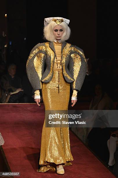 Model walks the runway at the Thom Browne Women's fashion show during Mercedes-Benz Fashion Week Fall 2014 at Center 548 on February 10, 2014 in New...