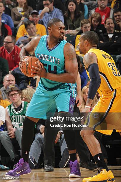 Jason Maxiell of the Charlotte Hornets defends the ball against the Indiana Pacers during the game on April 3, 2015 at Bankers Life Fieldhouse in...