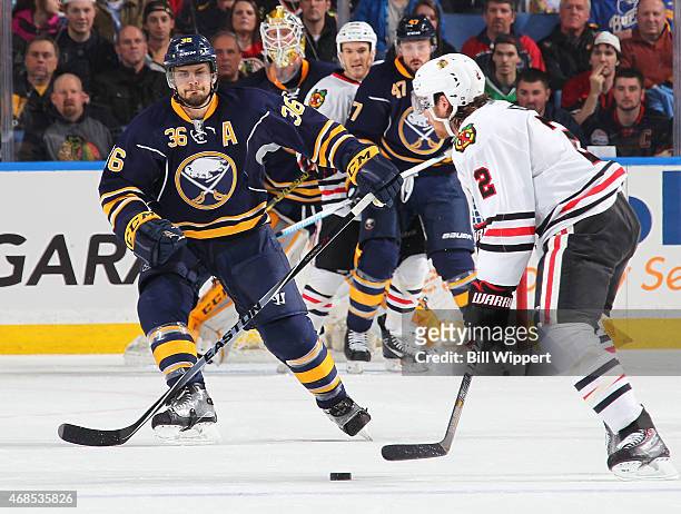Patrick Kaleta of the Buffalo Sabres looks to block the shot of Duncan Keith of the Chicago Blackhawks on April 3, 2015 at the First Niagara Center...