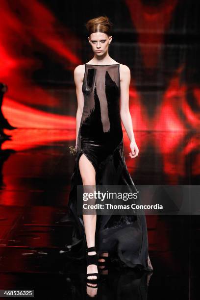 Model walks the runway at Donna Karan New York 30th Anniversary during Mercedes-Benz Fashion Week Fall 2014 at 23 Wall Street on February 10, 2014 in...
