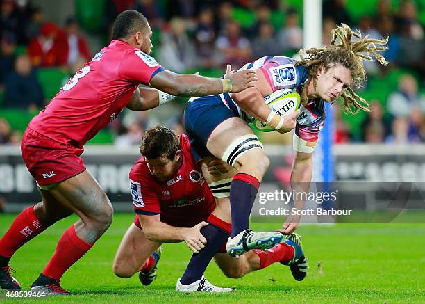 Jordy Reid of the Rebels runs with the ball during the round eight Super Rugby match between the Rebels and the Reds at AAMI Park on April 3, 2015 in...