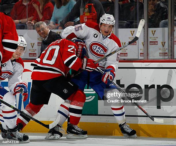 Sergei Gonchar of the Montreal Canadiens moves the puck away from Jordin Tootoo of the New Jersey Devils during the third period at the Prudential...