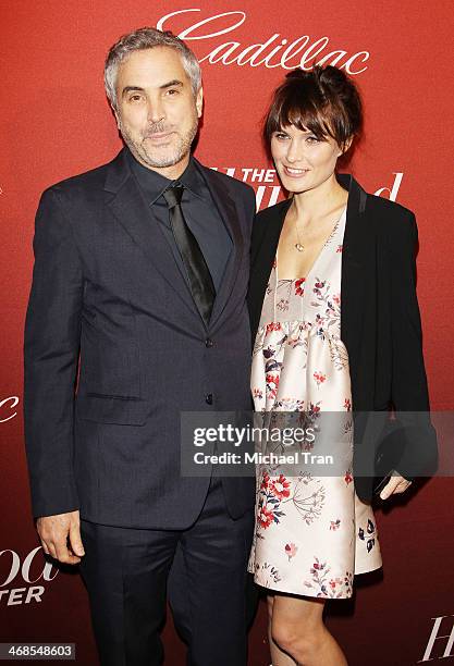 Alfonso Cuaron and Sheherazade Goldsmith arrive at The Hollywood Reporter's Annual Nominees Night party held at Spago on February 10, 2014 in Beverly...