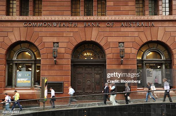 Pedestrians walk past the Commonwealth Bank of Australia branch at Martin Place in Sydney, Australia, on Monday, Feb. 10, 2014. Commonwealth Bank,...