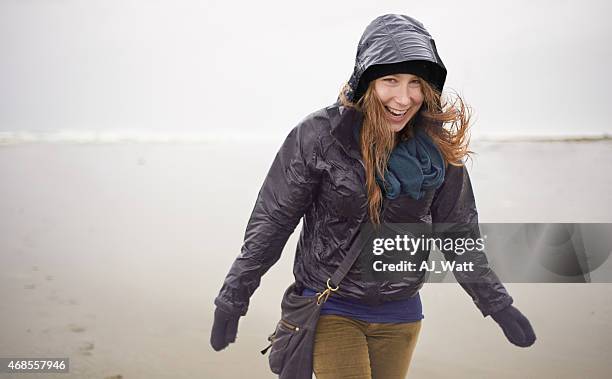feeling like a kid again! - rainy beach stock pictures, royalty-free photos & images