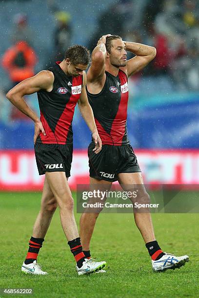 Joe Daniher and Tom Bellchambers of the Bombers look dejected after losing the Round One AFL match between the Sydney Swans and the Essendon Bombers...