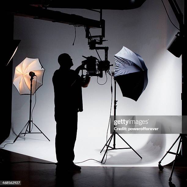 camera operator working on set - television studio lights stock pictures, royalty-free photos & images