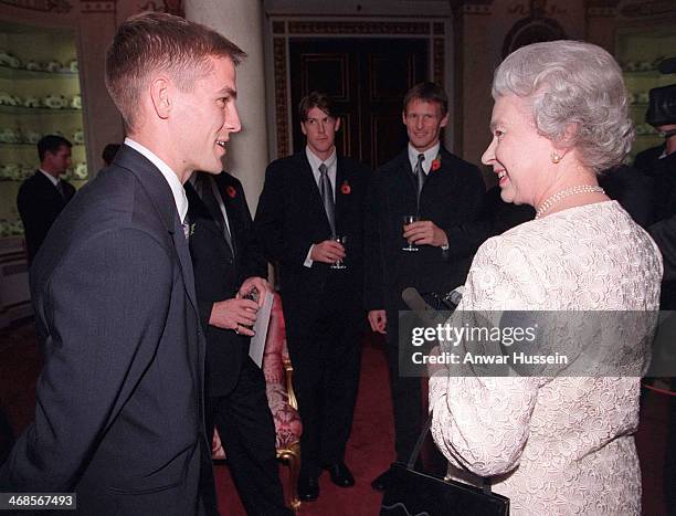 Queen Elizabeth ll meets Liverpool and England footballer Michael Owen during a reception for England, Scotland and Jamaican based football squads at...