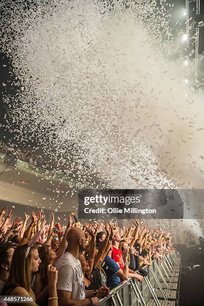 The crowd watch on as Above and Beyond perform onstage during the first of two sold out nights at Brixton Academy on April 3, 2015 in London, United...