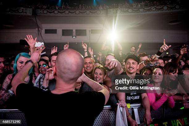 Jono Grant meets fans as Above and Beyond perform on stage during the first of two sold out nights at Brixton Academy on April 3, 2015 in London,...
