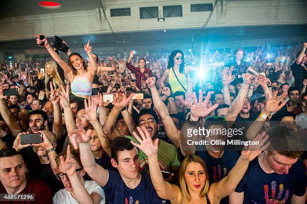 The crowd watch on as Above and Beyond perform on stage during the first of two sold out nights at Brixton Academy on April 3, 2015 in London, United...