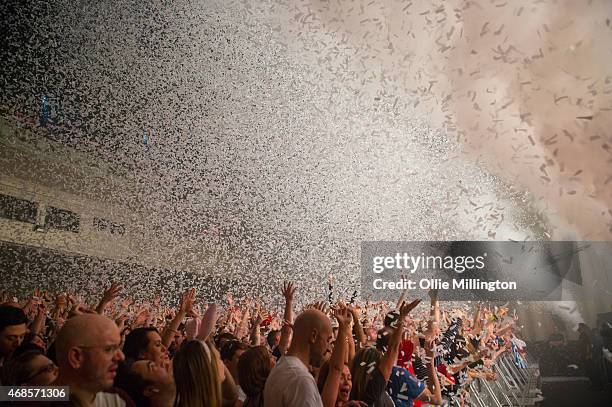 The crowd watch on as Above and Beyond perform onstage during the first of two sold out nights at Brixton Academy on April 3, 2015 in London, United...