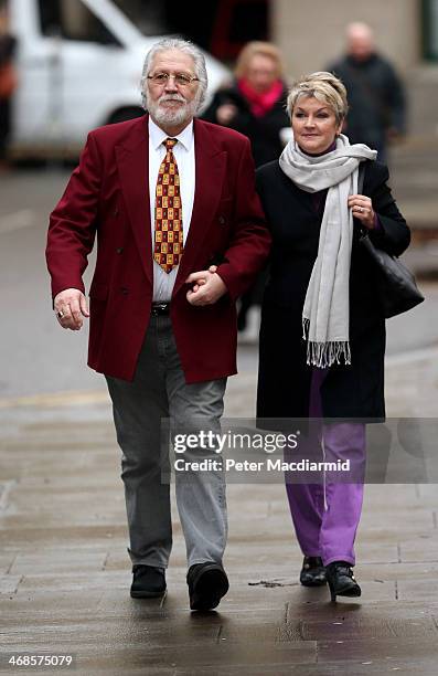 Dave Lee Travis arrives at Southwark Crown Court with his wife Marianne Griffin on February 11, 2014 in London, England. Dave Lee Travis, whose real...