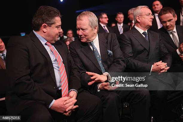 Vice Chancellor and Economy and Energy Minister Sigmar Gabriel chats with Porsche Governing Board Chairman Wolfgang Porsche as Volkwagen Chairman...