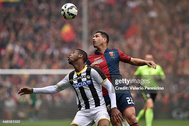 Marco Borriello of Genoa CFC competes with Molla Wague of Udinese Calcio during the Serie A match between Genoa CFC and Udinese Calcio at Stadio...