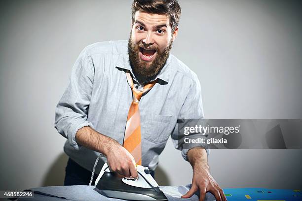 ironing is not a man's job. - dresssing stock pictures, royalty-free photos & images
