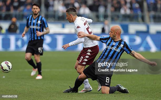 Giulio Migliaccio of Atalanta competes for the ball with Giuseppe Vives of Torino during the Serie A match between Atalanta BC and Torino FC at...