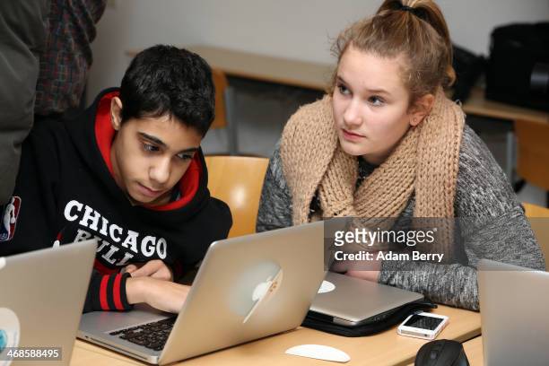 Students use Apple Mac computers at the Friedensburg Oberschule during the tenth annual Safer Internet Day on February 11, 2014 in Berlin, Germany....