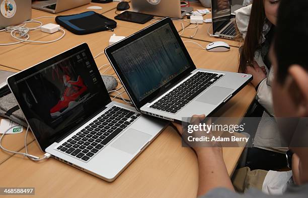 Students use Apple Mac computers at the Friedensburg Oberschule during the tenth annual Safer Internet Day on February 11, 2014 in Berlin, Germany....