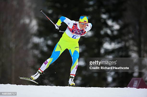 Katja Visnar of Slovenia competes in Qualification of the Ladies' Sprint Free during day four of the Sochi 2014 Winter Olympics at Laura...