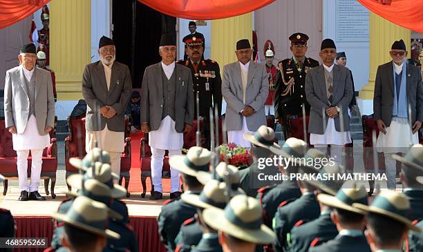 Nepalese President Ram Baran Yadav , Nepal's newly-elected prime minister Sushil Koirala , outgoing Chairman of the Interim Council of Ministers Khil...