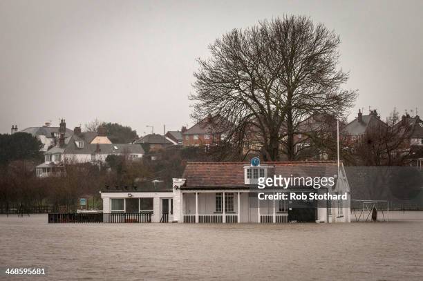 Floodwater surrounds the cricket pavilion on The King's School sports field close to the banks of the River Severn on February 11, 2014 in Worcester,...