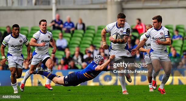 Leinster player Isaac Boss attempts to tackle Matt Banahan during the European Rugby Champions Cup Quarter Final match between Leinster Rugby and...