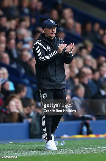 Manager Tony Pulis of West Brom applauds from the touchline during the Barclays Premier league match West Bromwich Albion and Queens Park Rangers at...
