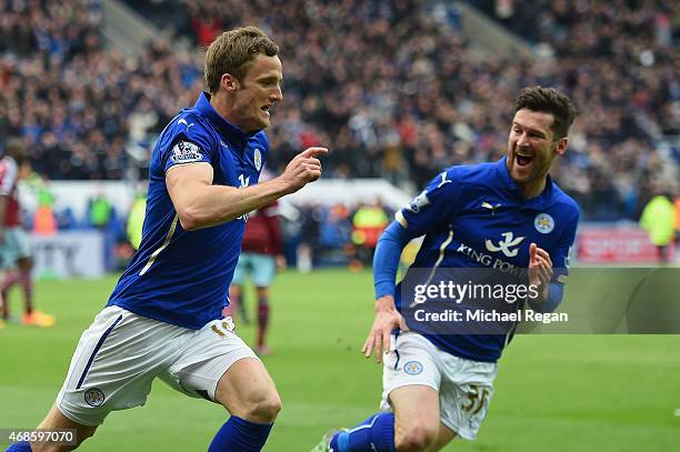 Andy King of Leicester City celebrates scoring their second goal with David Nugent during the Barclays Premier league match Leicester City and West...