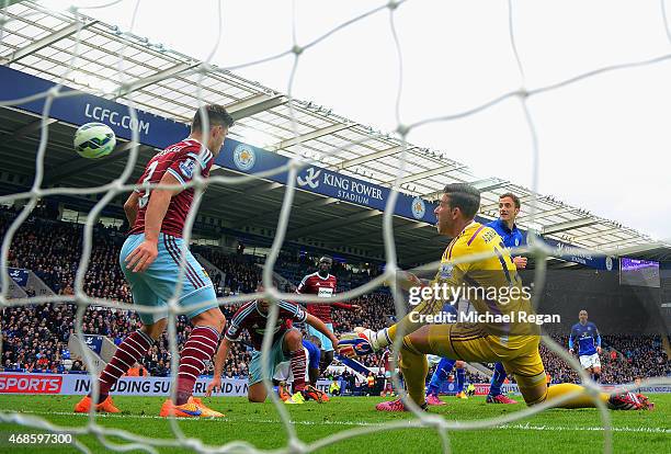 Andy King of Leicester City scores their second goal past Adrian of West Ham during the Barclays Premier league match Leicester City and West Ham...