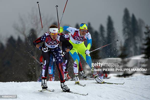 Sophie Caldwell and Slovenia's Katja Visnar compete in the Women's Cross-Country Skiing Individual Sprint Free Quarterfinals at the Laura...
