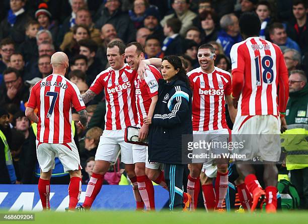 Charlie Adam of Stoke City celebrates with team-mates after scoring his team's first goal during the Barclays Premier League match between Chelsea...