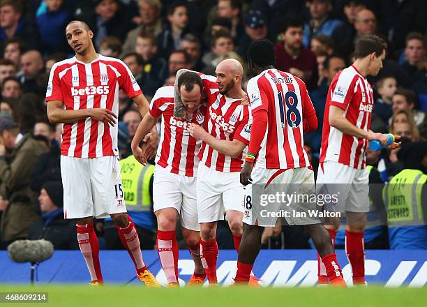 Charlie Adam of Stoke City celebrates with team-mates after scoring his team's first goal during the Barclays Premier League match between Chelsea...