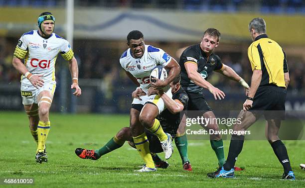 Naipolioni Nalaga of Clermont Auvergne is held by Calum Clark during the European Rugby Champions Cup quarter final match between Clermont Auvergne...