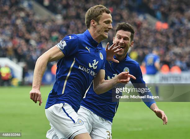 Andy King of Leicester City celebrates scoring their second goal with David Nugent during the Barclays Premier league match Leicester City and West...